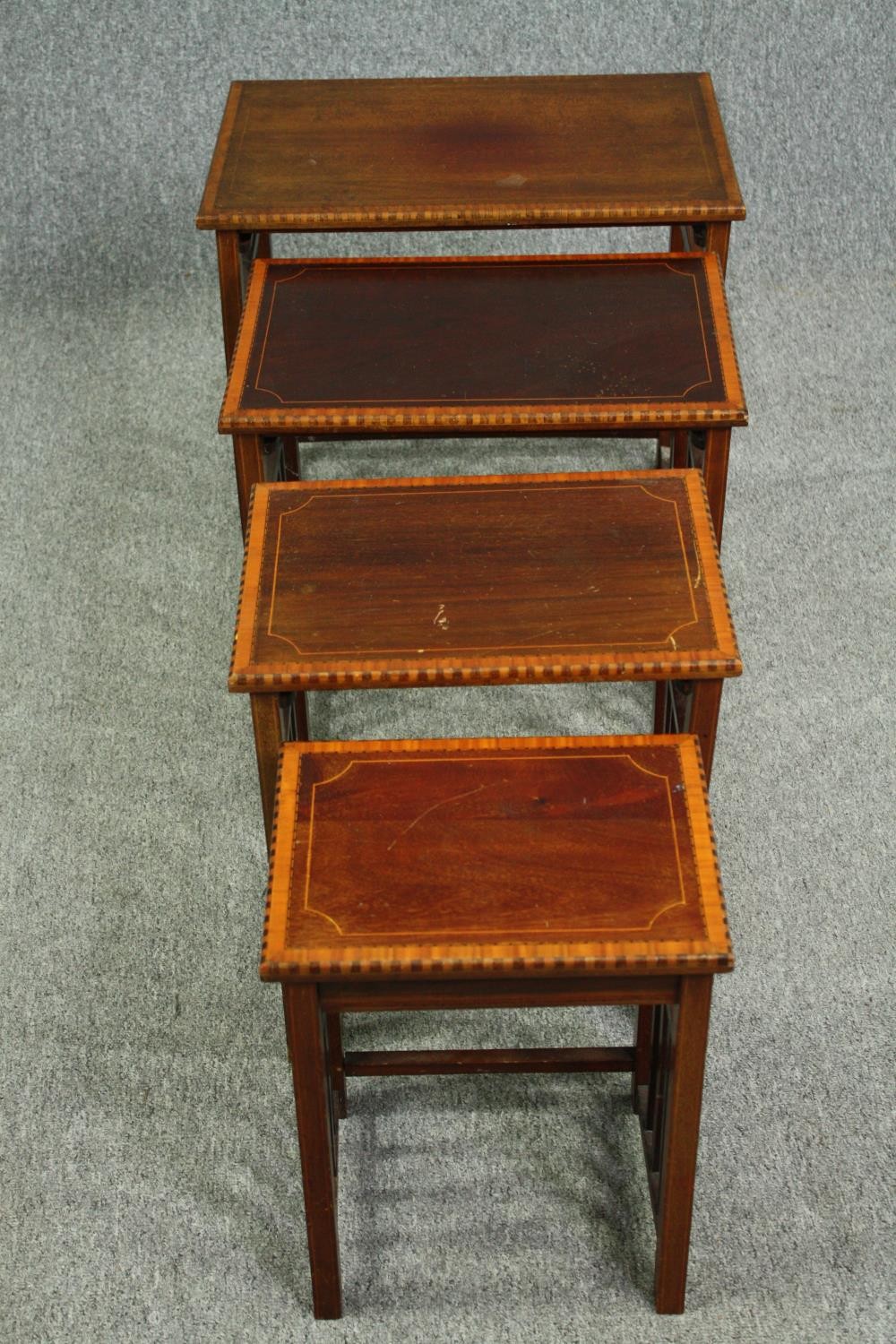 A nest of four graduating Edwardian mahogany and satinwood inlaid occasional tables. H.54 W.56 D. - Image 2 of 5