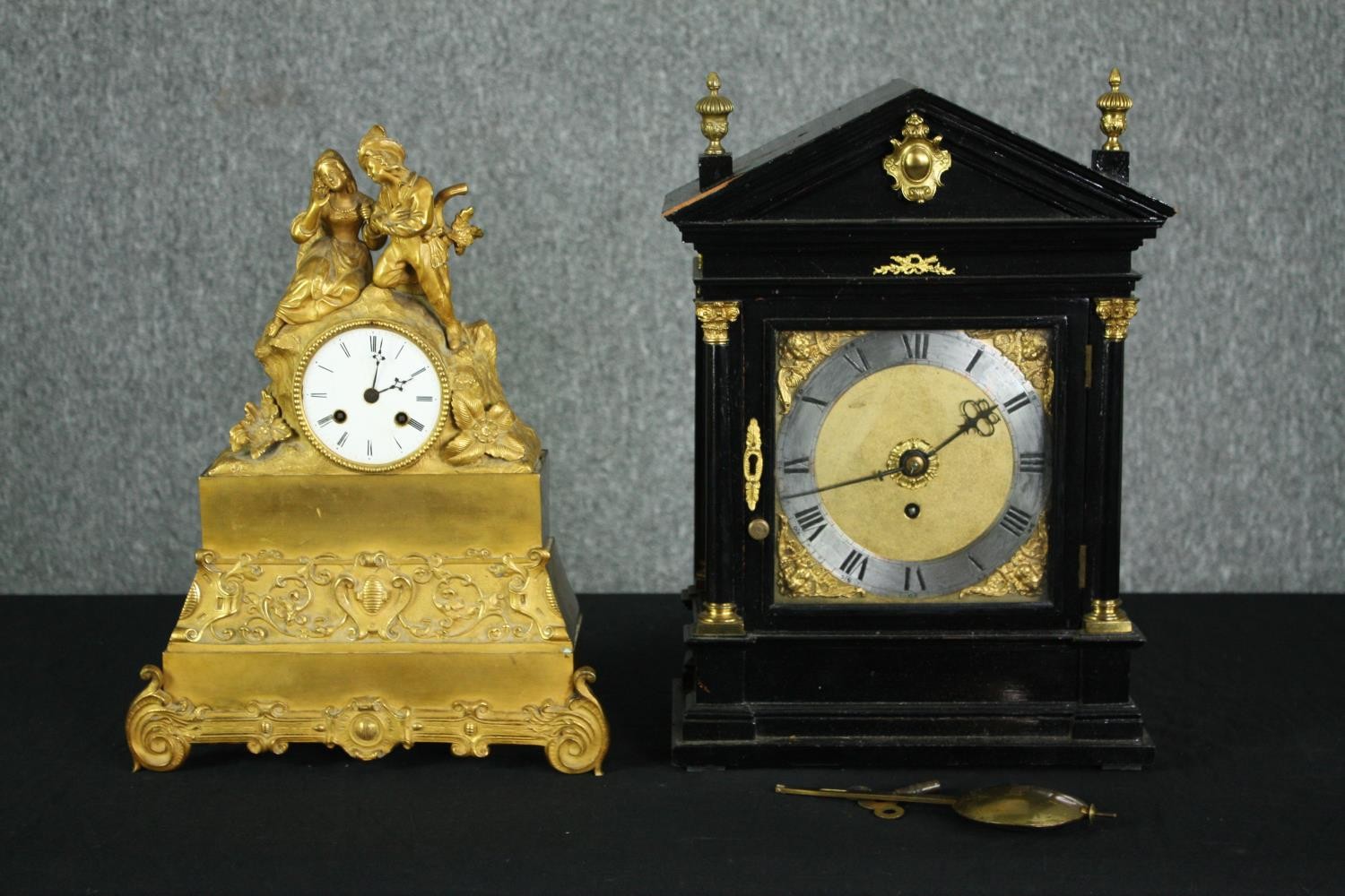 A 19th century French gilt metal mantel clock and a late 19th century ebonised and ormolu mounted