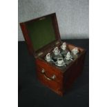 A Georgian mahogany decanter box fitted with it's six original decanters. H.27 W.30 D.23cm. (Two