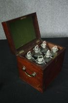 A Georgian mahogany decanter box fitted with it's six original decanters. H.27 W.30 D.23cm. (Two