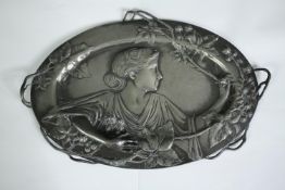 A WMF style Art Nouveau pewter wall plaque with flowing naturalistic decoration. Stamp to back. H.26