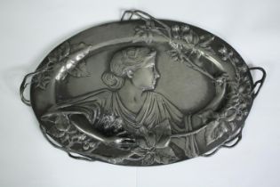 A WMF style Art Nouveau pewter wall plaque with flowing naturalistic decoration. Stamp to back. H.26