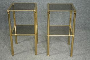 A pair of contemporary brass and glass lamp tables. H.73 W.40 D.40cm. (each)