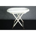 A late 19th century French porcelain baby or footbath on metal stand. H.44 W.50 D.29cm.