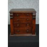 A Victorian oak miniature table top chest with carved locking stile. H.31 W.34 D.22cm.