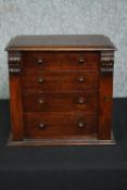 A Victorian oak miniature table top chest with carved locking stile. H.31 W.34 D.22cm.