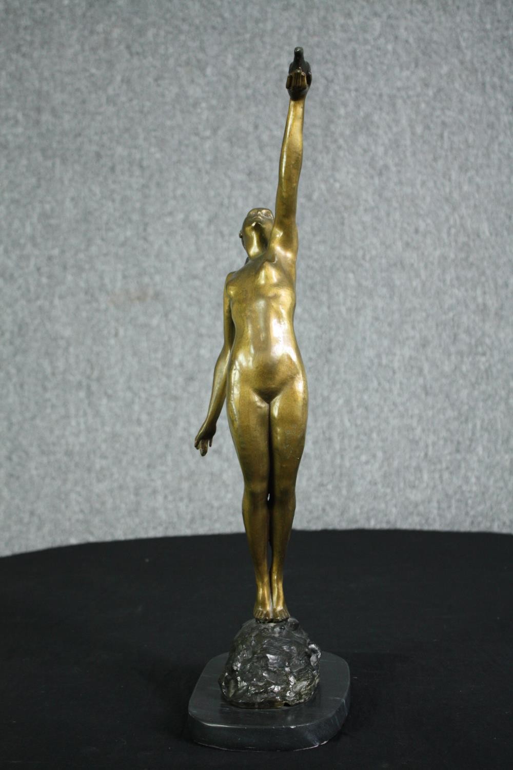 Pierre le Faguays, French (1892 - 1962), a patinated bronze figure, Girl with Dove” H.56cm. - Image 5 of 8