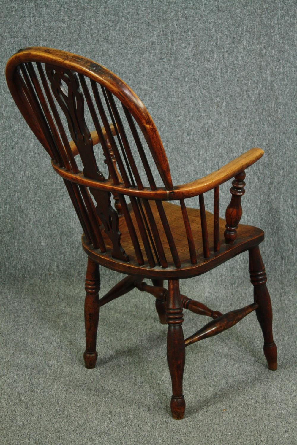 A 19th century elm and yew Windsor armchair with hooped back and pierced splat on turned stretchered - Image 3 of 7