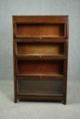 Bookcase, mid century Globe Wernicke style mahogany in four sections with maker's mark to the