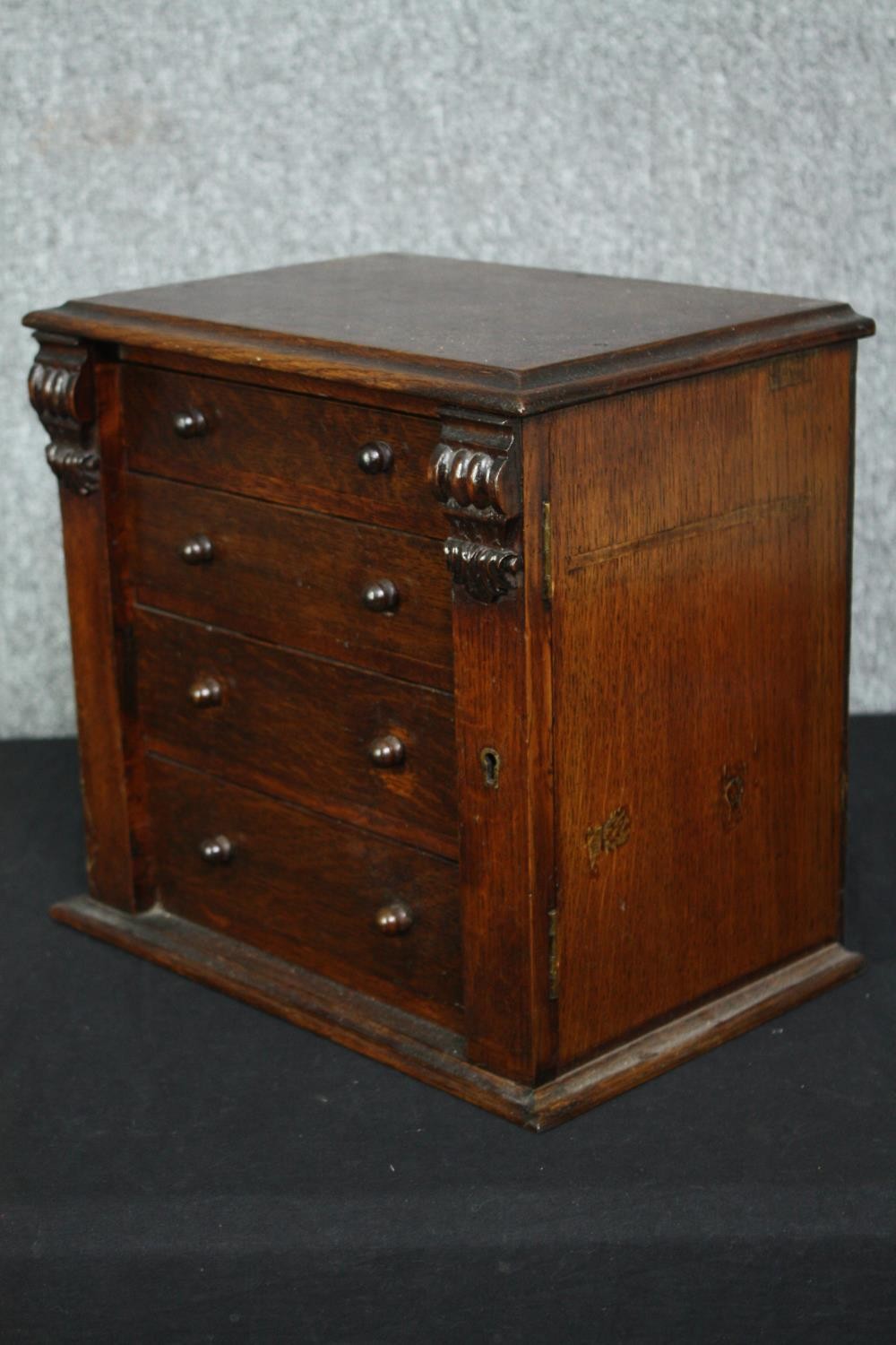 A Victorian oak miniature table top chest with carved locking stile. H.31 W.34 D.22cm. - Image 3 of 6