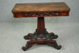 Tea table, late Regency rosewood on profusely carved base. H.71 W.91 D.90cm. (ext)