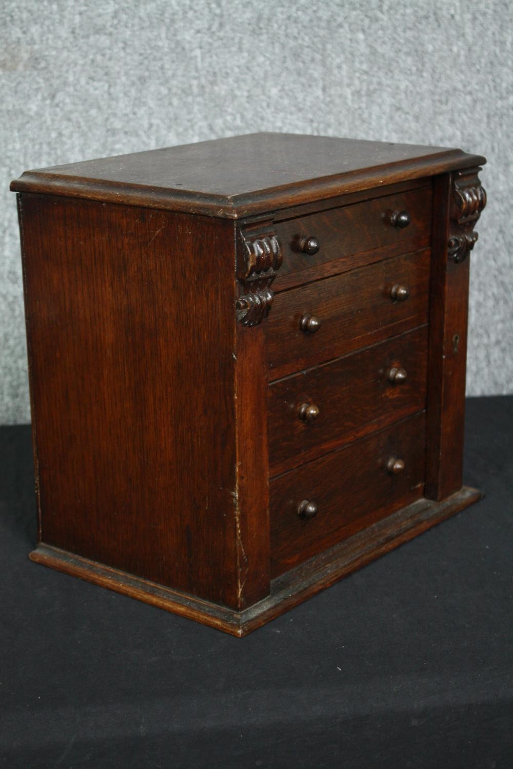 A Victorian oak miniature table top chest with carved locking stile. H.31 W.34 D.22cm. - Image 2 of 6