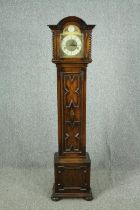 A mid to late 20th century grandmother clock in oak case. H.166cm.