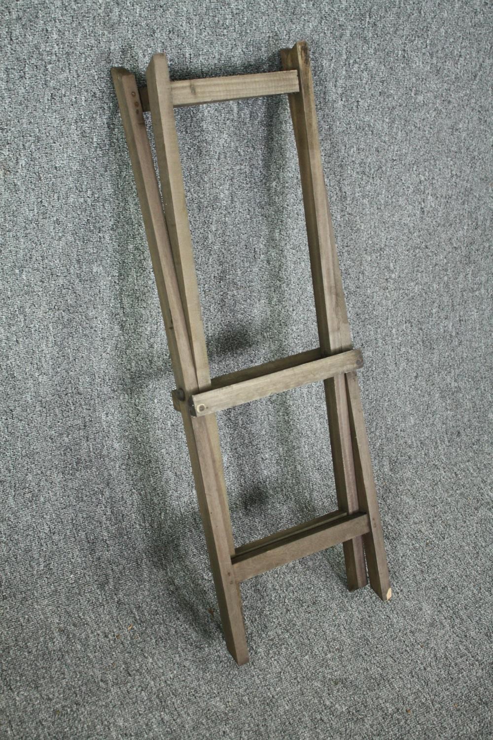 A set of three graduating fitted trays on a folding stand. H.80 W.52 D.33cm. - Image 4 of 4