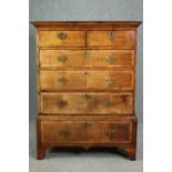 Chest of drawers, early Georgian crossbanded walnut on base fitted with drawer. H.133 W.96 D.47cm.