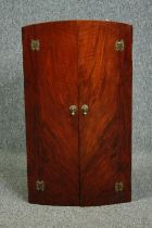 A mid century Art Deco style burr walnut hanging corner cabinet. H.72 W.40 D.24cm.