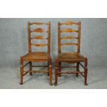 A pair of 18th century elm Lancashire ladderback dining chairs.