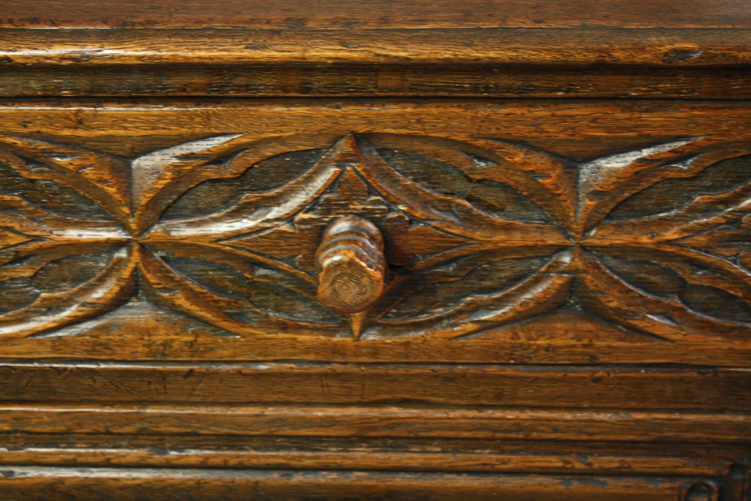 A mid century Ipswich oak side cabinet in the Jacobean style with carved flowerhead and linen fold - Image 7 of 9