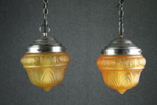 A pair of Art Deco amber glass ceiling light pendants. H.35 Dia.25cm. (each).