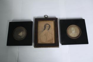 A 19th century ink and wash portrait miniature along with a pair of 19th century miniature