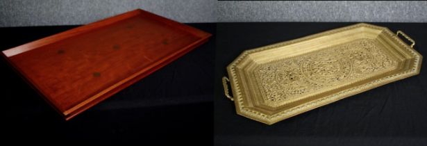 An Indian pierced brass tray along with a hardwood tray inset with coins. H.78 W.44cm.