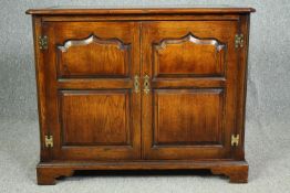 A late 20th century oak country Georgian style cabinet with fitted interior. H.76 W.92 D.49cm.