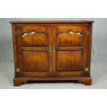 A late 20th century oak country Georgian style cabinet with fitted interior. H.76 W.92 D.49cm.