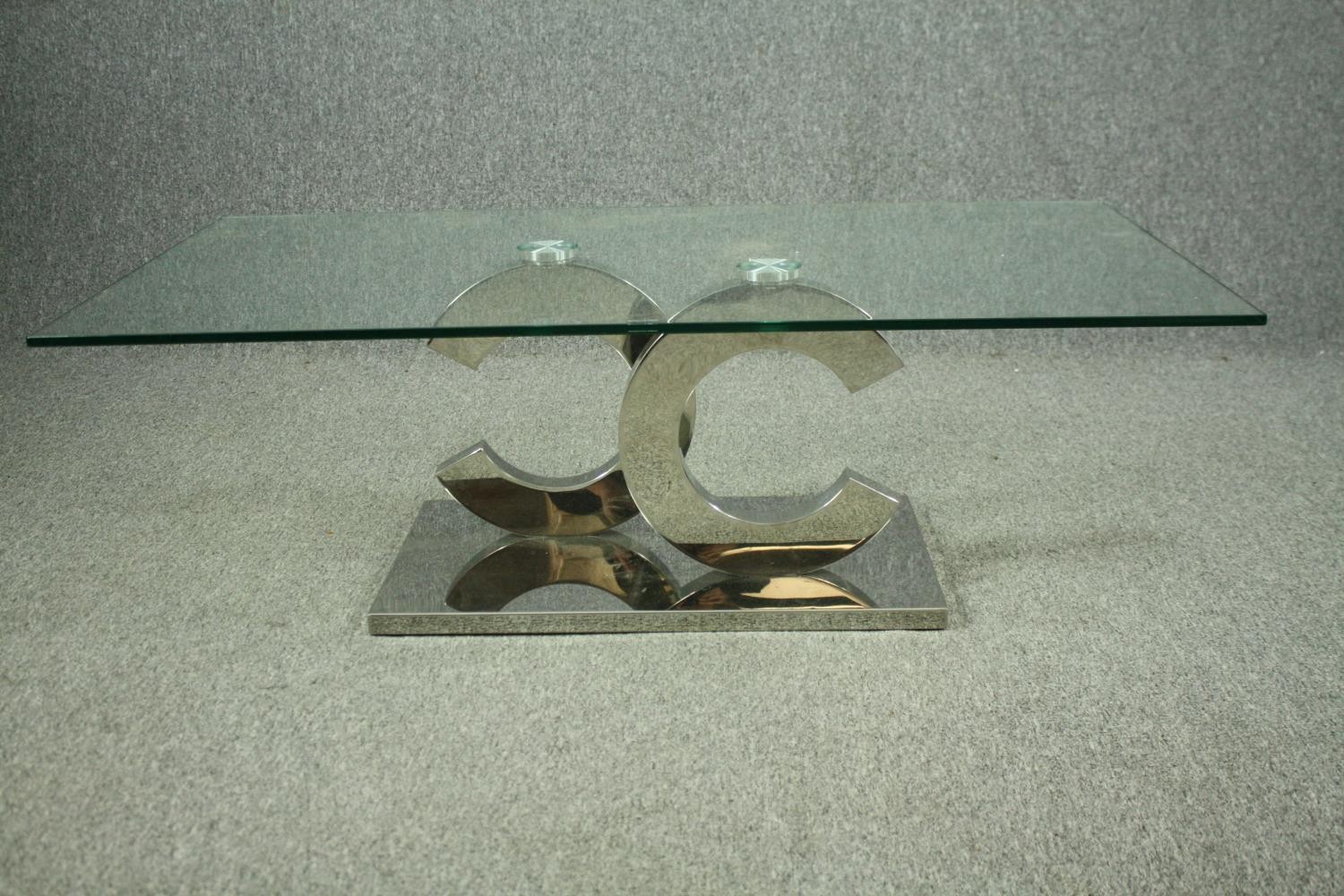 Coffee table, contemporary with plate glass top on a chrome base. H.42 W130cm. - Image 3 of 8
