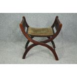 A late 19th century mahogany folding X frame stool. H.60 W.60 D.45cm.