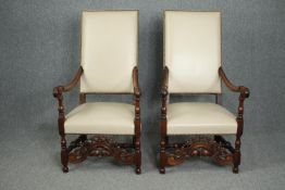 Throne style armchairs, a pair, C.1900 Carolean style oak in studded ivory leather upholstery. H.