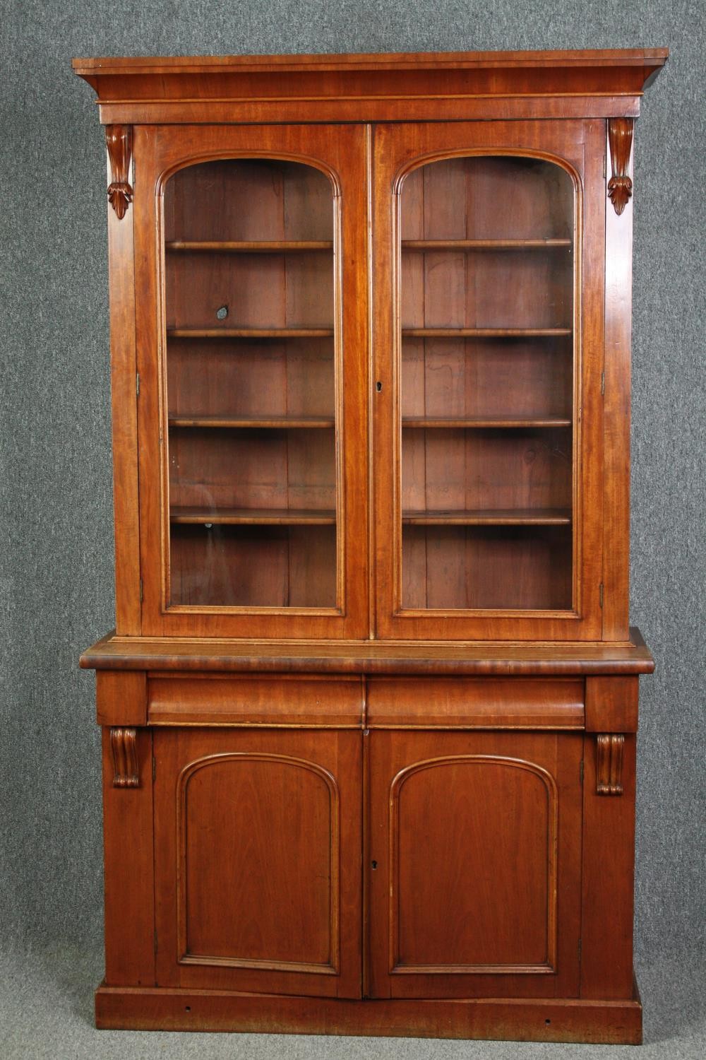 Library bookcase, 19th century mahogany, in two sections. H.211 W.120 D.45cm.