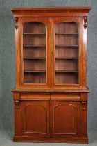 Library bookcase, 19th century mahogany, in two sections. H.211 W.120 D.45cm.