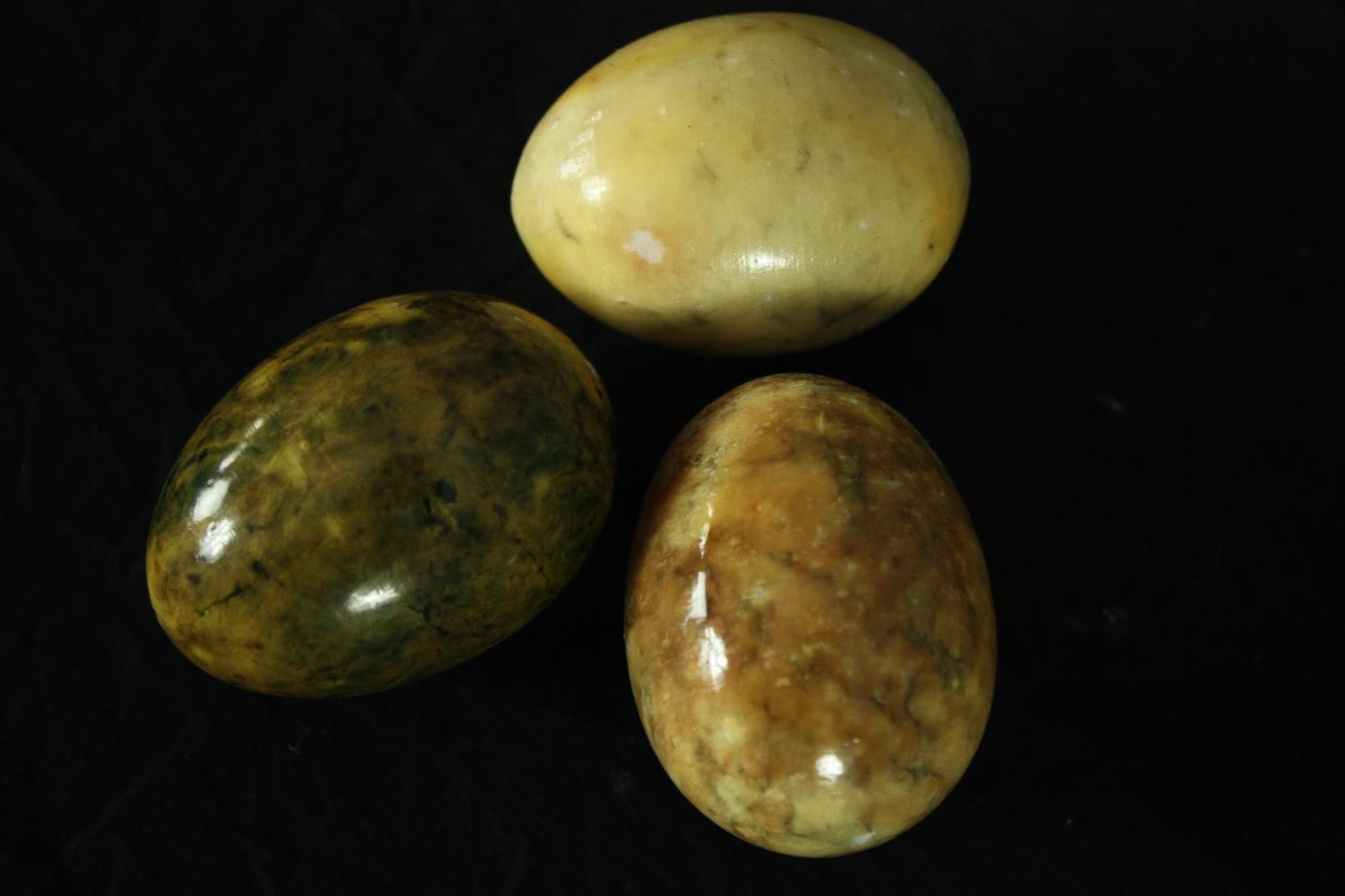 A collection of polished hardstone eggs including two hand decorated. H.7cm. (largest) - Image 6 of 6