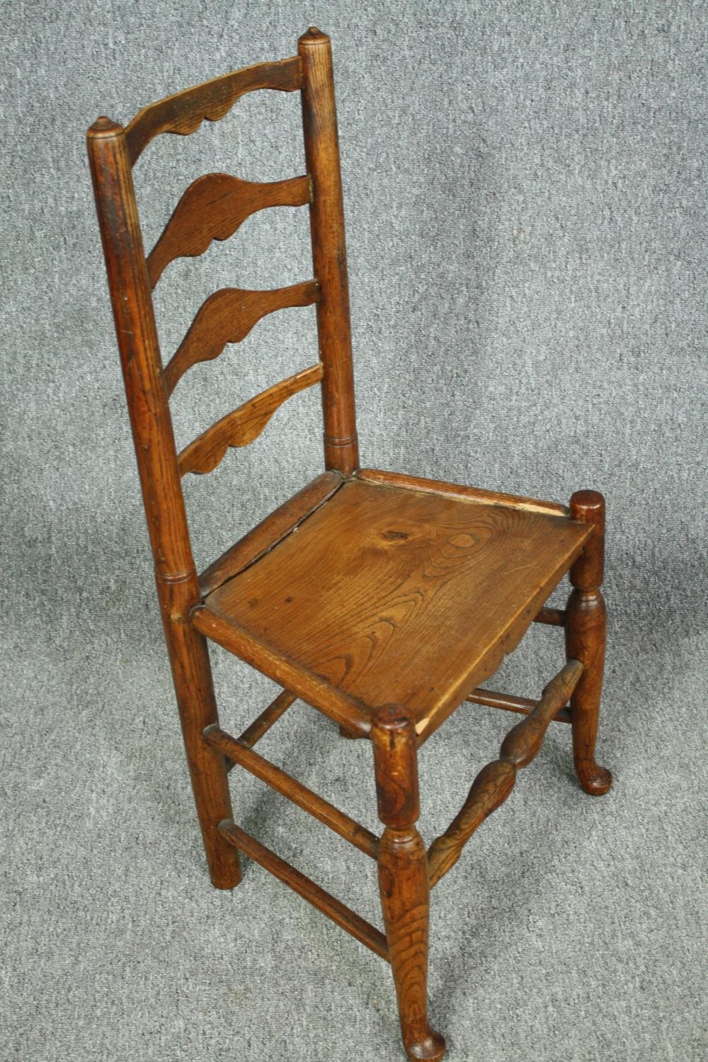 A pair of 18th century elm Lancashire ladderback dining chairs. - Image 3 of 7