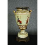 A 19th century ceramic urn, hand decorated with Classical figures with bronze interior and base. H.