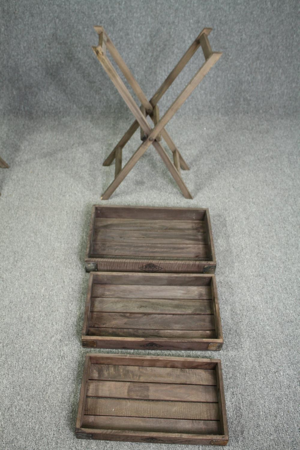 A set of three graduating fitted trays on a folding stand. H.80 W.52 D.33cm. - Image 3 of 4