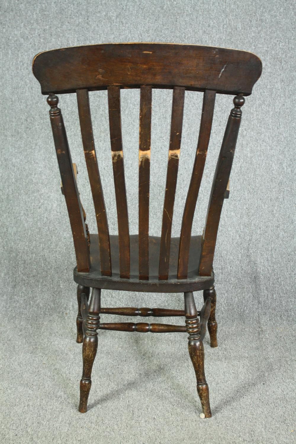 A 19th century beech and elm stick back kitchen armchair. H.114cm. - Image 5 of 5