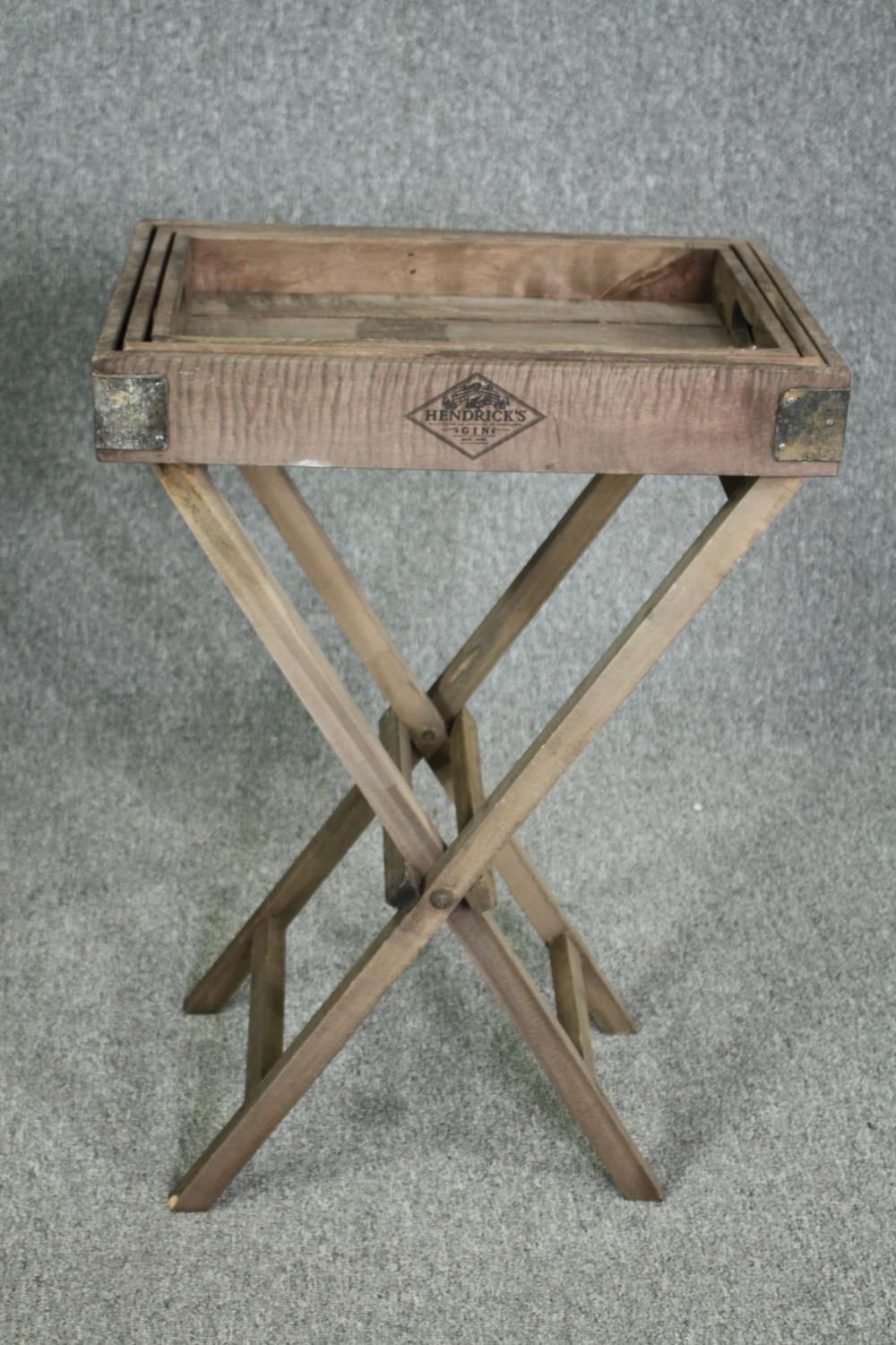A set of three graduating fitted trays on a folding stand. H.80 W.52 D.33cm. - Image 2 of 4