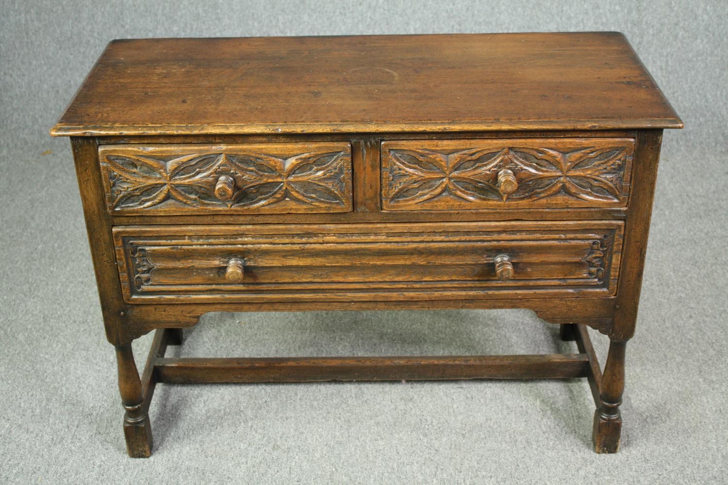 A mid century Ipswich oak side cabinet in the Jacobean style with carved flowerhead and linen fold - Image 4 of 9