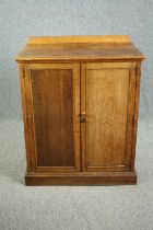 Pantry cupboard, C.1900 oak with panel doors enclosing shelves. H.107 W.87 D.51cm.