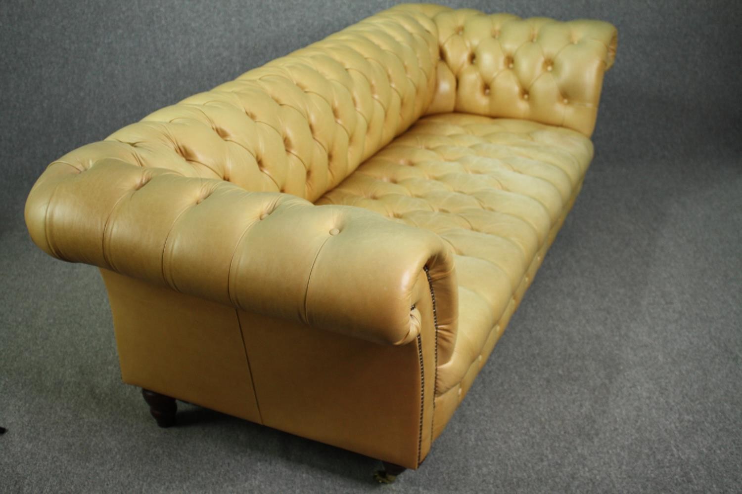 Chesterfield sofa, Victorian style in deep buttoned and studded leather upholstery raised on - Image 6 of 8