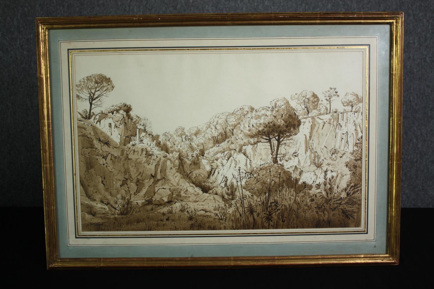 A 19th century framed and glazed sepia wash study of a rocky landscape. H.50 W.70cm. - Image 2 of 3