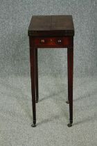 A late Georgian mahogany foldover top games table. H.75 W.63(ext) D.45cm.