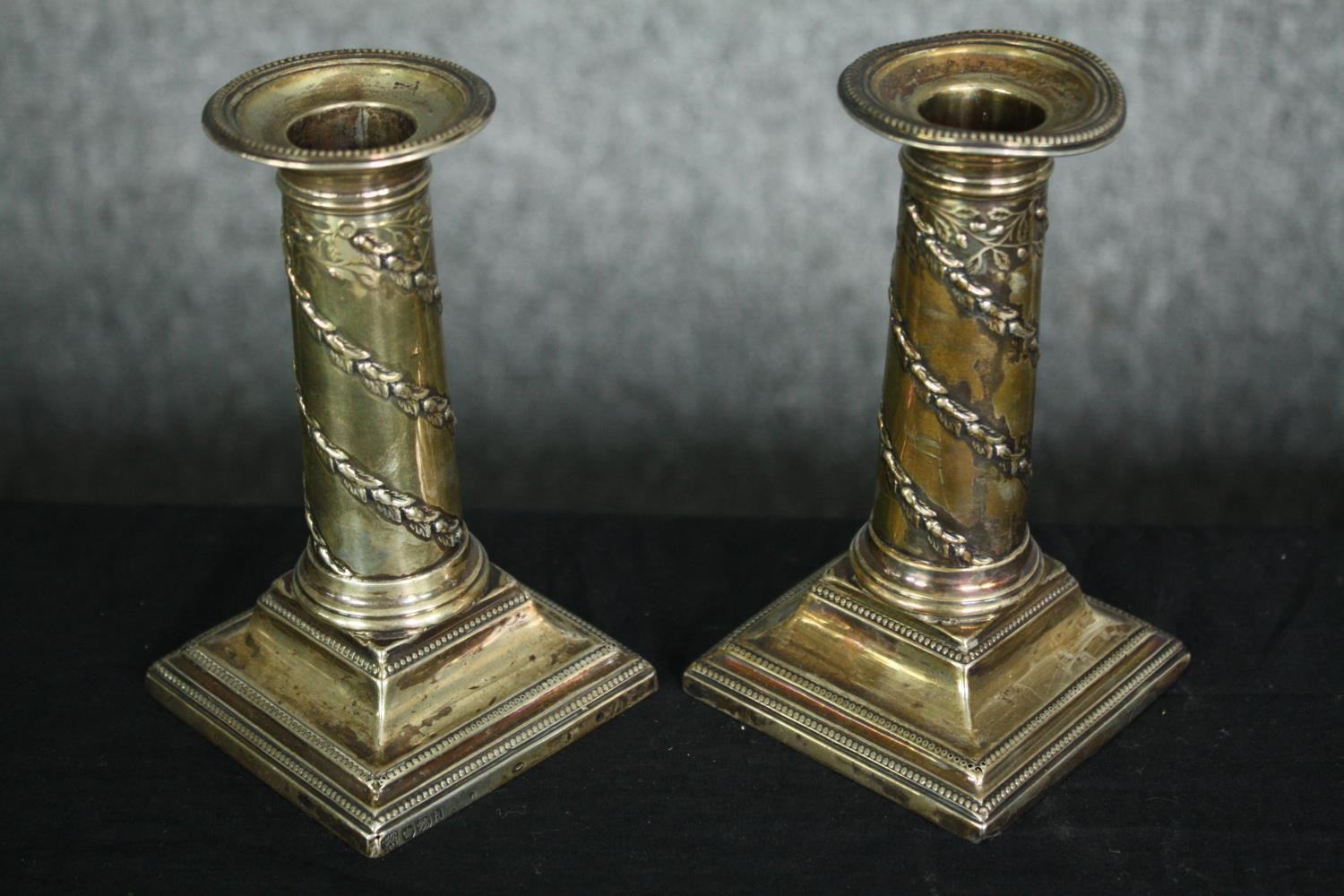 A collection of hallmarked silver to include a pair of filled candlesticks, a pair of salts, and a - Image 4 of 18