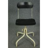 A vintage industrial machinist chair with swivel, adjustable action, marked TAN-SAD. H.80cm.