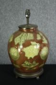 A contemporary lamp base of bulbous form decorated with old cartography motifs. H.43cm.