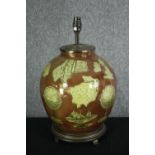 A contemporary lamp base of bulbous form decorated with old cartography motifs. H.43cm.