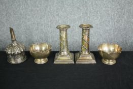A collection of hallmarked silver to include a pair of filled candlesticks, a pair of salts, and a