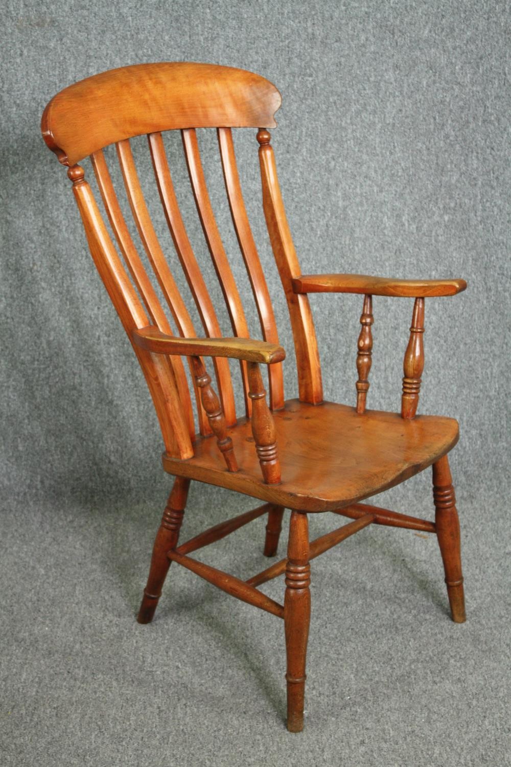 A 19th century elm seated bar back kitchen armchair. H.110cm. - Image 2 of 4