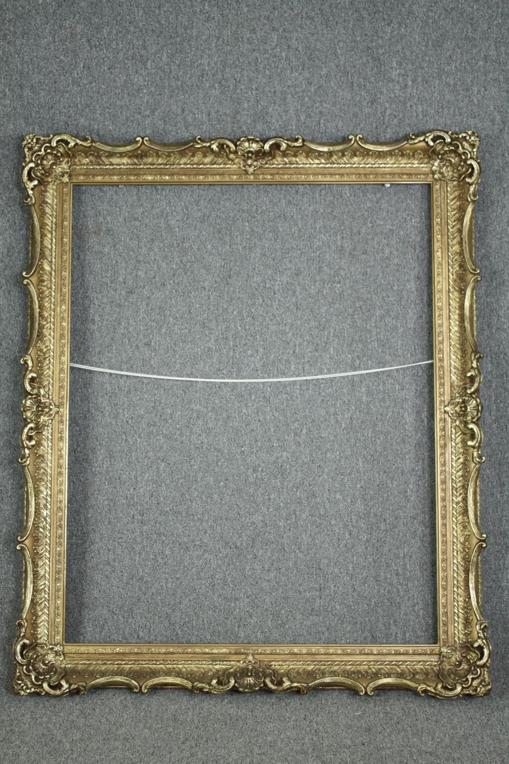 A large giltwood and gesso picture or mirror frame. H.150 W.120cm.